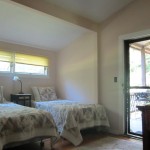 Clean bedroom with sunlight