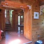 foyer with sylighting, pine walls