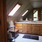 Clean bathroom with large mirror