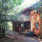 Wooded view of Crosswinds with elevated catwalk.