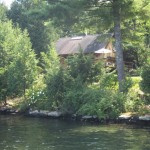 House with lake in foreground.